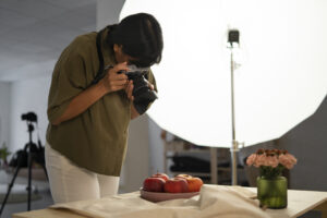 medium-shot-photographer-taking-fruit-photos